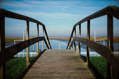 Pier over sea against sky