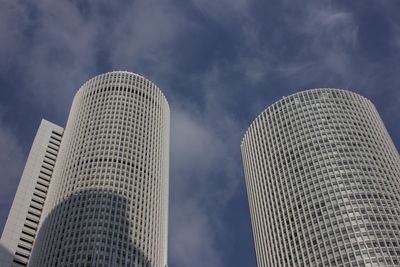 Low angle view of modern buildings against sky