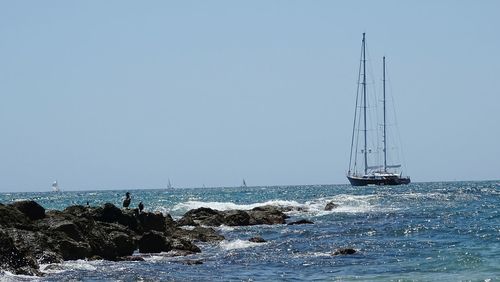 Sailboat sailing in sea