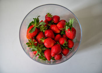 High angle view of strawberries in bowl on table