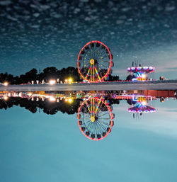 Ferris wheel against sky at night