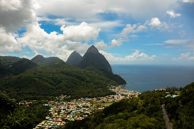 High angle view of townscape by sea against sky