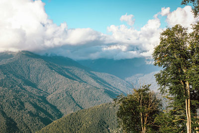 Beautiful view of the mountains with big clouds in the blue sky