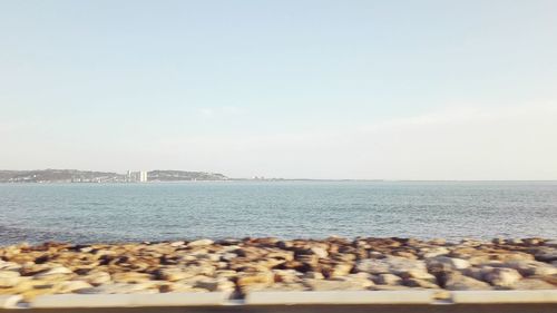 Scenic view of sea against clear sky