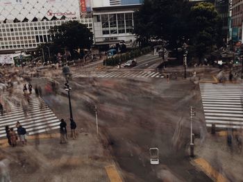 High angle view of people walking on road