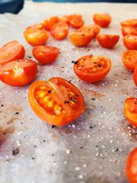 High angle view of tomatoes on orange