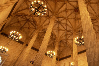 Low angle view of illuminated chandelier