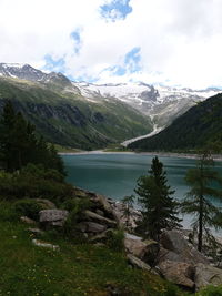 Scenic view of lake and mountains against sky