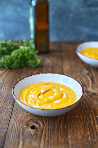 Pumpkin puree soup. vertical photo. place for text.