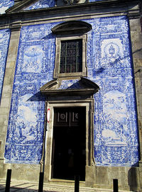 Low angle view of blue door on building