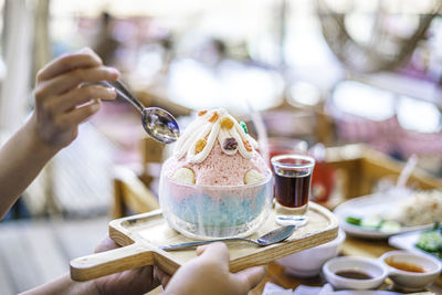 Iced sweet snow cones with colorful food in the cafe