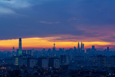 Cityscape against sky during sunset