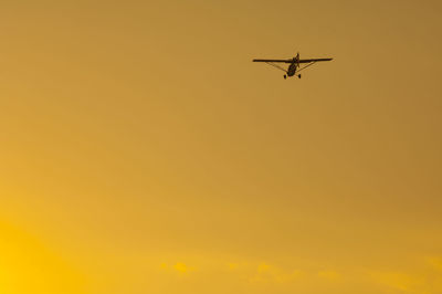 Low angle view of airplane in sky