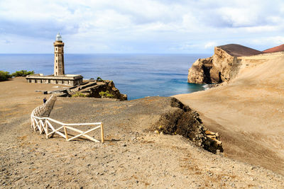  panoramic view of lighthouse and sea against the sky