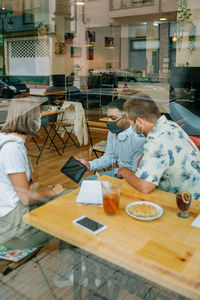People sitting at restaurant table