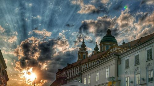 Low angle view of building against sky during sunset