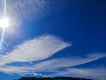 Low angle view of clouds in blue sky on sunny day