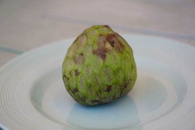 High angle view of fruit in plate on table