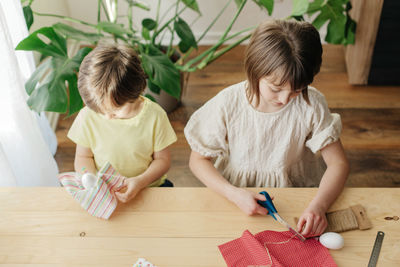 Mother painting on table