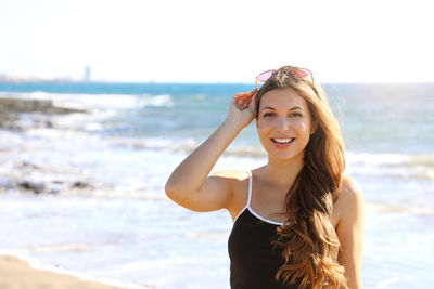 Portrait of beautiful young woman on beach