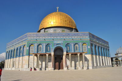 Dome structure against clear blue sky