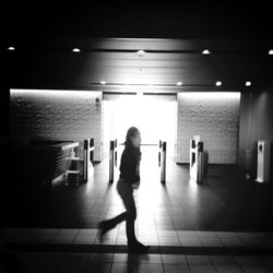 Full length of woman standing on floor