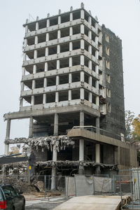 Construction site against sky in city