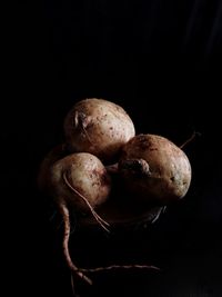 Close-up of fruits against black background