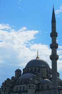 Low angle view of mosque against blue sky