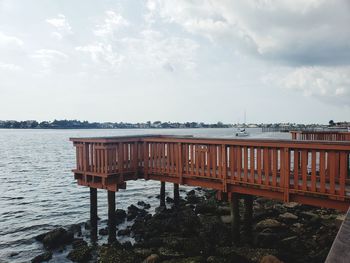 Pier over sea against sky