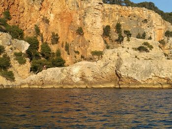 Scenic view of sea against mountain