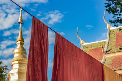 Low angle view of bell tower against blue sky