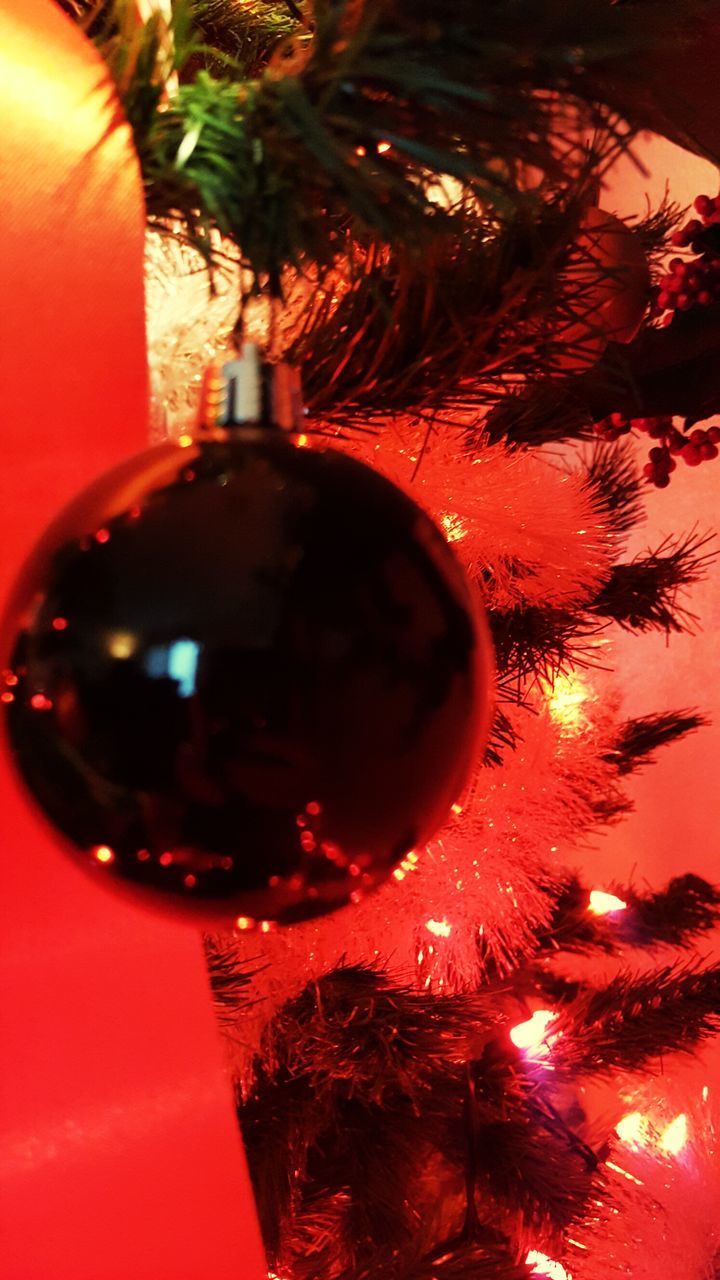 indoors, illuminated, lighting equipment, table, red, decoration, close-up, still life, drink, home interior, no people, lit, glass - material, hanging, electric light, low angle view, wineglass, reflection, celebration, transparent