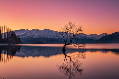 Scenic view of lake against sky during sunset