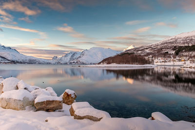 Scenic view of snowcapped mountains against sky during sunset