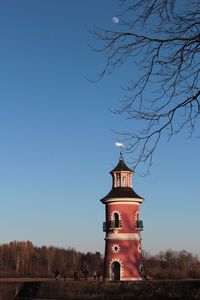 View of tower of building against blue sky