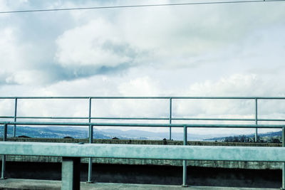 Bridge against sky seen through window