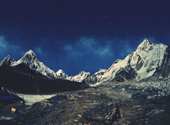 Scenic view of mountains against sky at night