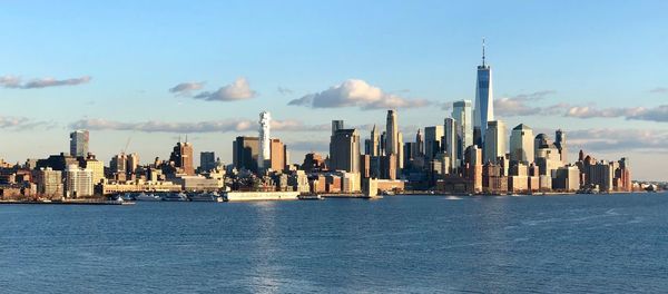 Panoramic view of buildings on city against sky