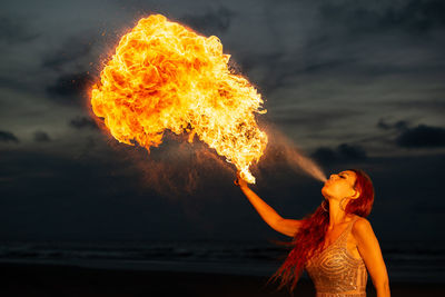 Fire breathing with donia serena on the beach