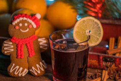 Close-up of drink and gingerbread cookie on table