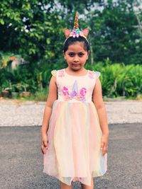 Portrait of girl standing outdoors