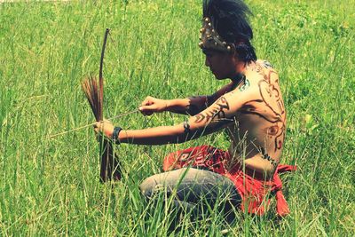 Man standing on grassy field