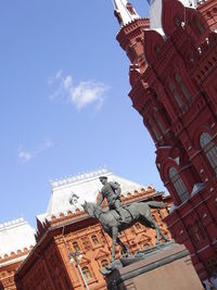 Low angle view of statue against sky