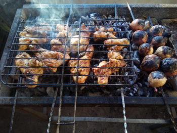 High angle view of meat on barbecue grill