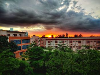 Buildings against sky during sunset