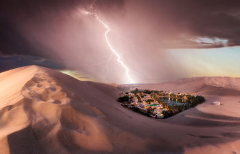 Lightning in sky over mountains