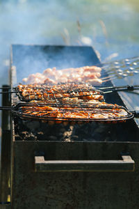 High angle view of meat on barbecue grill