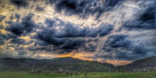 Scenic view of landscape against sky during sunset