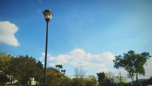 Low angle view of street light against sky